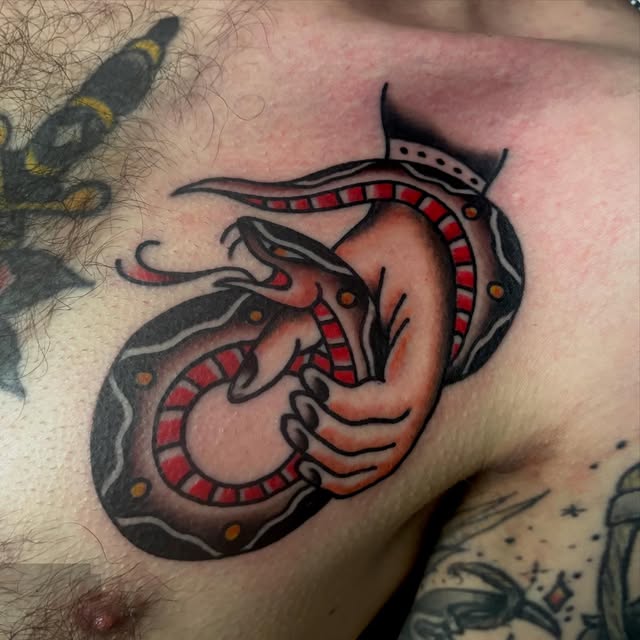Traditional dragon tattoo in black and red by Matt Pounder