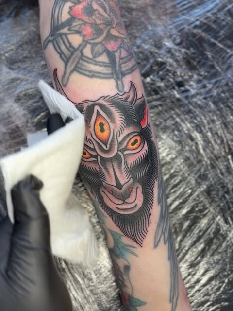 Traditional three-eyed horned face tattoo by Matt Pounder