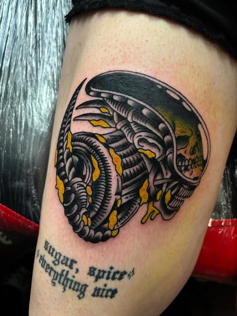 Black and yellow biomechanical skull tattoo by Matt Pounder